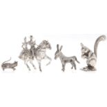A Spanish miniature silver model of a couple on horseback and three other Continental miniature