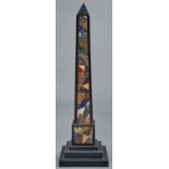 A Victorian Ashford black marble obelisk, late 19th c  inlaid with coloured hardstones, on stepped