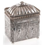 A Dutch silver tea caddy, the domed lid with pierced gallery, the sides embossed with figures,
