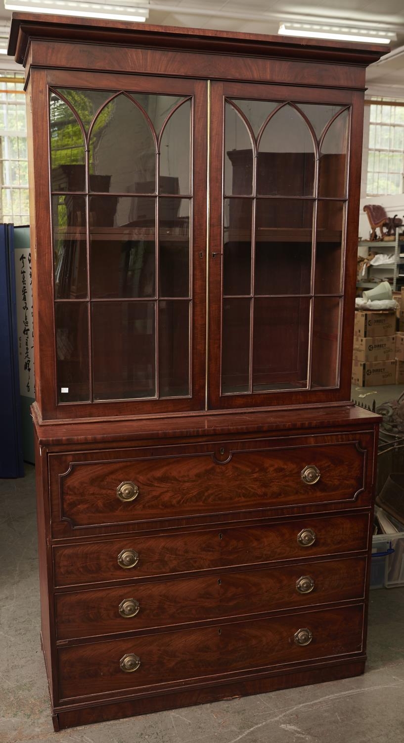 A George III mahogany secretaire bookcase in the manner of Gillows, c1800, the cabinet with