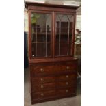 A George III mahogany secretaire bookcase in the manner of Gillows, c1800, the cabinet with