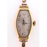 An 18ct gold tonneau wristwatch, 27mm, import marked London 1925, on gold expanding bracelet