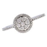 A diamond cluster ring,  with diamond shoulders, in white gold, marked 750, 2.9g, size O Good