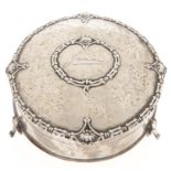 A George V round silver trinket box on three feet, engraved Jean, 90mm diam, by E S Barnsley & Co,