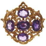 An amethyst brooch, 19th c, in chased gold openwork, 9.7g Good condition for age