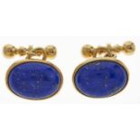 A pair of lapis lazuli cufflinks en cabochon, in 18ct gold, London 1994 Slight wear scratches and