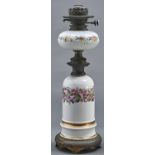 A French brass mounted porcelain oil lamp, late 19th c, the domed base painted with wild roses,