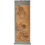 A Chinese scroll, painted with an extensive mountainous landscape with lake, a figure standing on