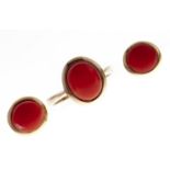 A pair of coral ear studs and a similar ring, both in gold, 5.6g Good condition