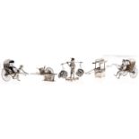 Five Chinese miniature silver models of rickshaws, a palanquin, barrow and man carrying baskets on a