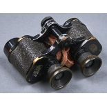 Binoculars. Zeiss DF8x, leather case Paint rubbed and worn showing brass or alloy, dents around