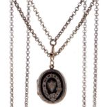 A Victorian giltmetal muff chain and a giltmetal and enamel mourning locket