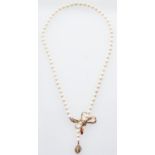A cultured pearl necklace with diamond set 14ct gold bow clasp, 30g Good condition