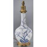 A giltmetal mounted Chinese style blue and white bottle vase table lamp, 20th c, 51cm h excluding