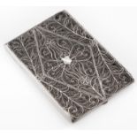 A silver filigree cigarette case, early 20th c, 12cm l, unmarked, 3ozs 10dwts Sides slightly dented