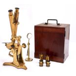 An early brass bar limb Wenham binocular compound microscope, J B Dancer Manchester, No 38, c1860