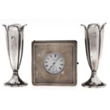 A George V  silver mounted leather covered travelling clockcase, 90 x 90mm, by A & J Zimmermann,