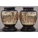 A pair of Japanese Satsuma cobalt ground shouldered oviform vases, Meiji period, enamelled with
