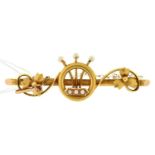 A pearl and gold bar brooch, early 20th c, marked 15ct, 3.7g Good condition