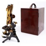 A brass  compound binocular microscope, W Watson & Sons Ltd London, No 11181, c1910, with three