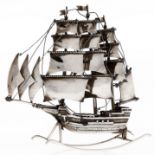 A Continental silver model of a three masted  ship  20th c,   on rockers, 11.5cm h, apparently