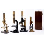 Four brass and ferrous metal compound microscopes, late 19th and early 20th c, Schutz A-G Cassel, No