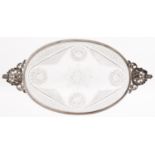 A Victorian oval silver mounted cut glass dish, the cast openwork handles with putti and mask, 29cm,