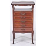 An Edwardian serpentine mahogany music cabinet, 55cm w Gallery damaged in one place but complete