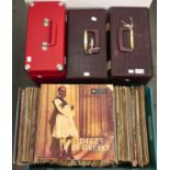 An extensive collection of vintage vinyl LP records in three cases and a box