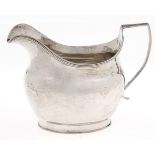 A George III silver cream jug, with reeded rim and handle, 92mm h, by Samuel & Edward Davenport,