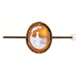 A  cameo  brooch, the oval shell carved with a girl with a basket, in gold mount,  on later gold