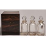 A Victorian marble wood decanter case, the fitted interior lined in morocco and retaining three (