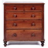 A Victorian mahogany chest of drawers, the rectangular top with rounded front corners above two