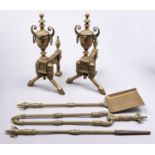 A pair of Victorian neo classical revival brass andirons and poker, shovel and tongs en suite,