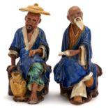 A pair of Chinese glazed biscuit figures of a scholar, 20th c, 19.5cm h Some damage