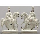 A pair of Staffordshire highlander equestrian flatback figures, 19th c, enamelled in gilt detail,