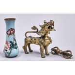 A South East Asian cast bronze sculpture of a mythical beast, 16cm h and a bronze varja (2) Both