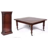 A Victorian mahogany extending dining table, c1860, the rectangular top with rounded corners above