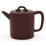 A Chinese Yixing stoneware teapot and cover,  of plain cylindrical shape, the flat cover with two