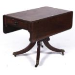 A Regency mahogany Pembroke table, the rectangular top with pair of rounded rectangular leaves, on a