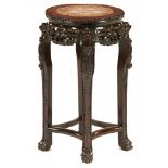 A Chinese carved hongmu stand, c1900, with stone inset top, 61cm h, 34cm diam