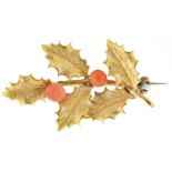 A gold holly leaf brooch, with two coral button berries,  2.9g Solder repair