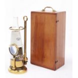 A brass microscope oil lamp, J Swift & Son, London WC, late 19th c,  with glass fount and stopper,