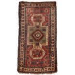 An antique Kars Kazak rug, early 20th C, 175 x 341cm Localised wear