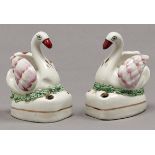 A pair of Staffordshire  earthenware swan quill holders, c1870, 88mm h   Good condition