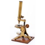 A brass compound microscope, the limb on trunnions with triangular bar and rack work, the body