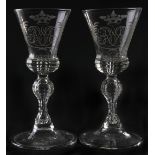 A pair of German  wine glasses, Saxony, mid 18th c, the cut thistle shaped bowl engraved with