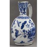 A Dutch delftware  ewer, 18th c, painted in Japanese style with larger groups of flowering plants