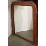 A Victorian oak overmantel mirror, late 19th c, with bevelled plate, 145cm h; 131cm l Slight