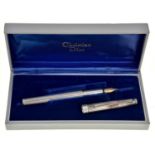 Christian Dior. A silver fountain pen, maker's marks, cased Good condition